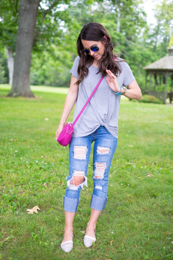 gray tee and ripped jeans